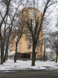 An apartment building on the street we walked on to the mall - like most it is very tall but seems newer than most.