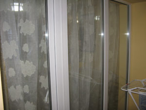 These are the doors from the balcon into the living room - behind the couch.