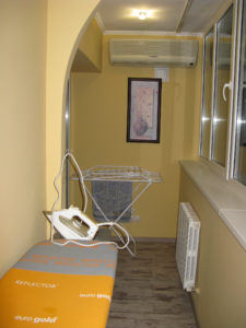 View of the balcon from near our bedroom - it is about four feet wide and about 24 feet long and is heated.  At the end is the drying rack for our clothes after we wash them - it opens up very large.  We have moved it now and there is a table there for our computer.  There are windows all along it and in the summer there are screens we can put in instead.