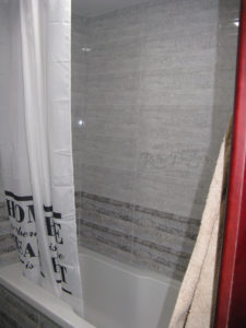 Bathroom tub and shower - the tub sits quite high so it is a climb into and out of but it is very nice