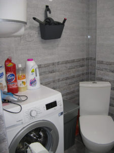 Toilet and washer in our bathroom.  The washer is very small and takes a long time to wash but it is so nice to have it in our apartment and not have to haul our clothes out.