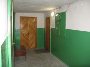 Hall outside our apartment with two other doors - not sure if anyone lives there yet.