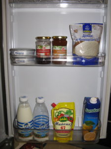 This is inside the refrigerator on the door. Top shelf: Philadelphia cream cheese, strawberry jelly, apricot jelly, yeast. Bottom shelf: two bottles of milk (1 liter each - sometimes it is sold in cardboard wax containers but we like the bottles best), mayonnaise, orange juice.