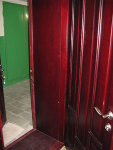 From our apartment out into the very green hallway.