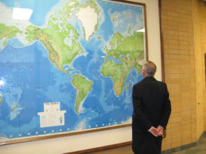 Carl looking at the Ukraine on the large world map in the MTC