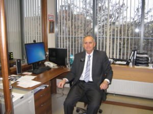 Here is Dad/Grandpa/Carl in his office. He has a large glass window where he can see what is happening in the rest of the office. I can see him from my desk. His office locks since he has the mission safe and many confidential files in his office.