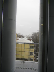 View out another one of the foyer windows. Notice all the satellite receivers.