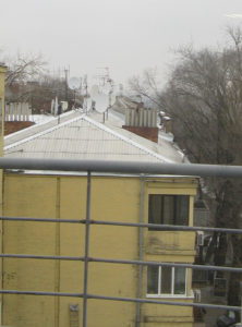 Here is a close up of the satellites dishes on the roof of what I believe is an apartment building.  There is a pharmacy on the first floor - pharmacies are all over.  There is another pharmacy right across the street from this one.