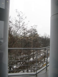 View out another one of the foyer windows. There is a small walkway and the president has a door out in his office.