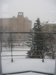 This is a view of the snow coming down shortly before we left for home today taken from our office window.