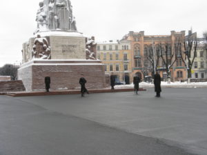 The cold guards move back to their leader and prepare to leave.
