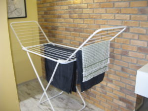 Here is our nice indoor drying rack.  It only has one small load of towels so far but I am about to go hang a load of darks on it and it will still have room for a small load of whites.  It doesn't look so big but it holds a lot.  And it is inside and warm and our clothes do not freeze on it.