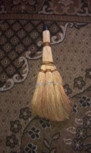 A typical broom used by everyone here. So short you have to stoop over to use it.