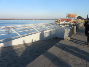 Another view of Cafe Caravan - you can almost see the tables and booths down by the water where the boats can come in as well.