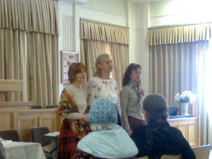These three women in pioneer, Ukrainian and modern dress sang a beautiful Ukrainian hymn.