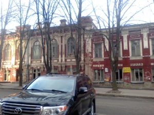 We pass this building everyday. At one time I think it was probably a beautiful building but now it has grafiti on it and broken windows and it is a crumbling version of what once was. We often hear dogs barking inside.