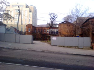 Back behind gates is this building that also was probably once a very nice building.