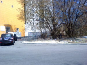 To the left is the walkway we take to our apartment between the very nice buildings and the "dump" which is filled with litter and broken down buildings.