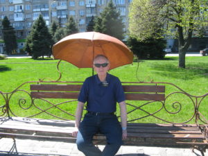 Along the way there are many places to sit. This series of benches have metal sculptures with them. Elder Morgenegg is sitting under a metal umbrella. At least it blocks the sun.
