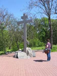 There is an inscription on the stone by the cross. It is on the way to the "temple" we saw on the island.
