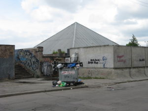 And across the street a dumpster. Interestingly these are all around. People just walk by and throw their trash bags in. When it gets to this stage a truck usually comes and empties it but often the mess around it stays until someone - not sure who - cleans it up.