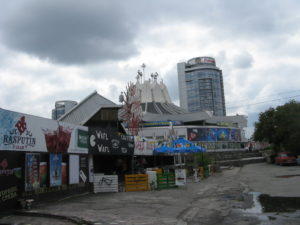 The building with the interesting roof is called the Circus and it actually is a Circus - I understand with animals and acrobats and trapezes and all.