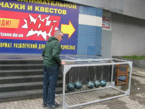 Carl trying out the bowling ball game - these are actually bowling balls and heavy - but same idea.