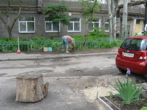 This is a picture that I probably should not have taken. This woman is sweeping her walkway with a little broom. The funny part is a big broom is sitting nearby but she prefers the small one that makes her bend way over. Makes no sense to us - traditions.