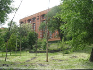 This building is up the hill from the park. Looks like a nice new building. Don't know if it is apartments or businesses or both.