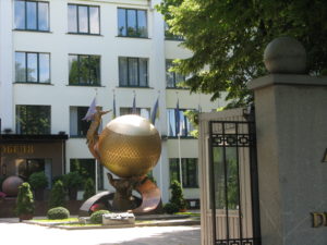 This very interesting statue is on the grounds of the university. It appears to be a large hand holding the world with a figure coming down to it Probably more but we were not very close.