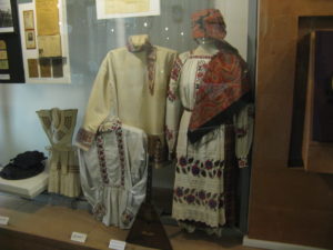 Native Ukrainian dress - notice the plaid skirt under the overdress with balalaika trim.