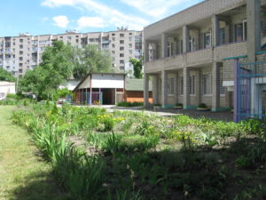 One day when we were a little late going to the office there were children and teachers gathered here in this area doing what appeared to be warm up exercises. The music stayed in my head for days. It was a very catchy tune.