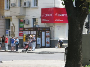 Behind the people under the red sign is a small vendor that sells sweets and baked goods. You can buy almost anything on the streets. We have been advised not to do so but sometimes I think what they sell certainly does look good.