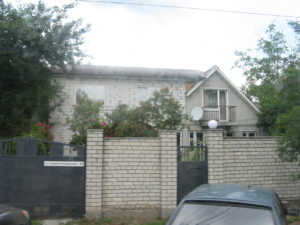 Many of the houses have high fences that you can see over on the tram and gates like this one does.