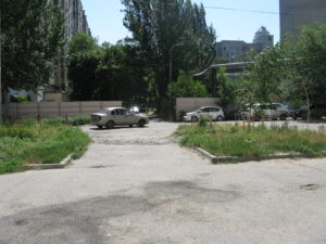 This is a view from our gate to the complex across the road. The car entrance is always open here. There is not a guard or a place for a guard. There is at least one other entrance at the other end and it is locked but this one is always open.
