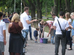 The little boy in blue actually dumped one bucket of bubble mix on the walkway. He had done that on another Sunday evening as well.